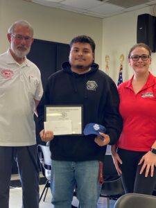 Rodolfo Rios Vasquez is pictured receiving the Ralmeg Scholorship at a ceremony Thursday with TRAACA. He is pictured with Pres. Bob Skrob and the donor the Scholorship, Megan Torres, of Ralmeg garage.